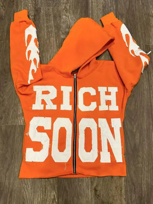 Front view of an orange full zip hoodie