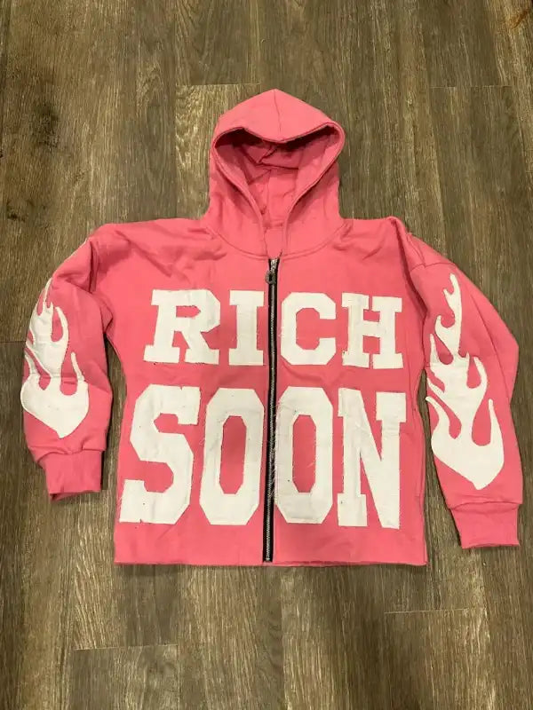 Front view of a pink full zip hoodie
