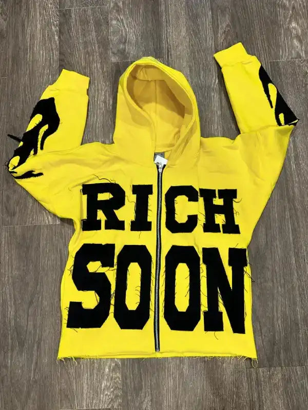 Front view of a yellow full zip hoodie