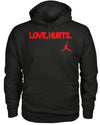 Front view of the black love hurts hoodie black pullover with bold red 'LOVE HURTS' text and a small red Jordan logo